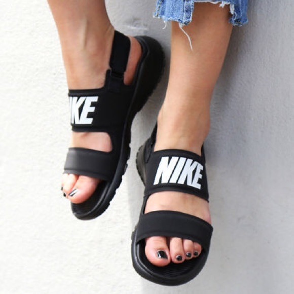nike sandals on feet